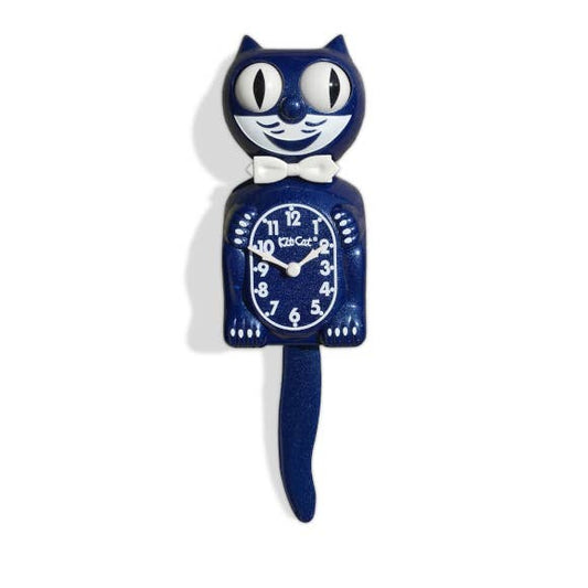 Blue sparkly vintage Kitty Kat Klock with a white bow tie on a white background