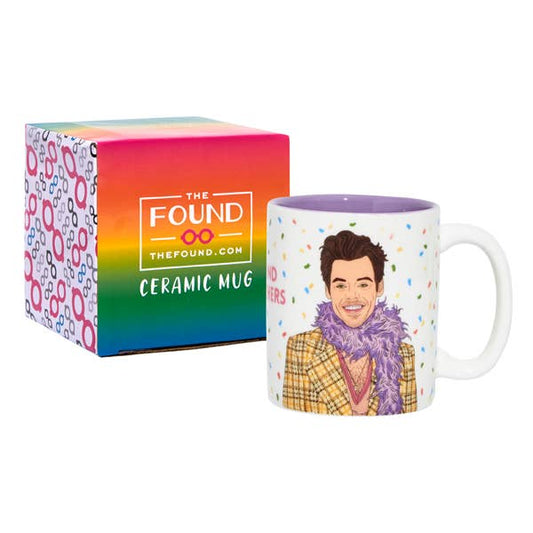 Ceramic Harry Styles mug with a colorful design and packaging box labeled 'The Found' on a white background.