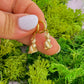Gold hoop earrings with detailed cats