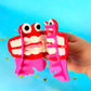 Mouth hair claw clip on a blue background