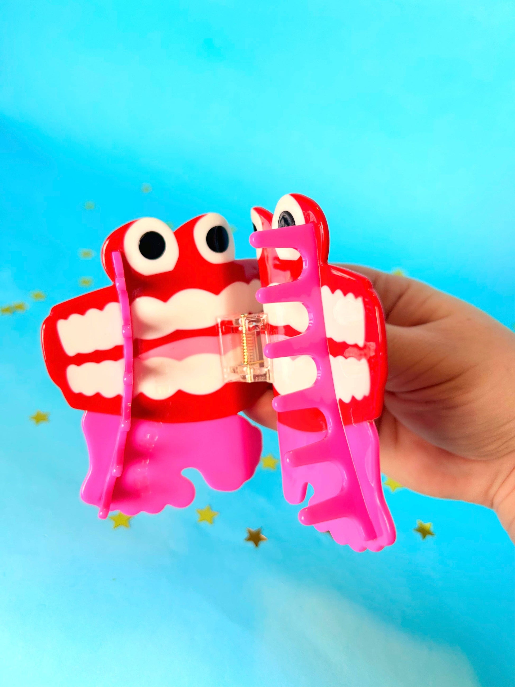 Mouth hair claw clip on a blue background