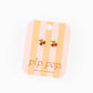 Pair of earrings on a 'pip pop' branded card with striped design