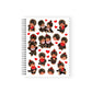 Notebook with Monchhichi character stickers on a white background