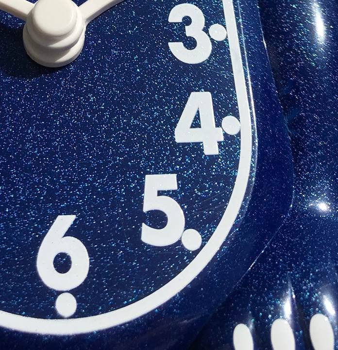 Close-up of a blue sparkly surface with white numbers