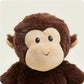 Plush monkey toy on a beige background
