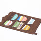 Magnet of a shelf with colorful bowls designs on a white background