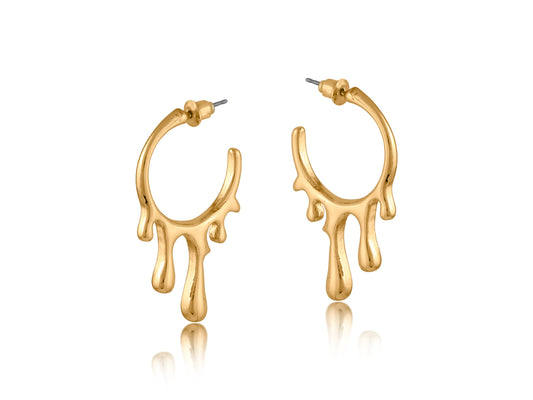 Gold drippy hoop earrings with a unique design on a white background