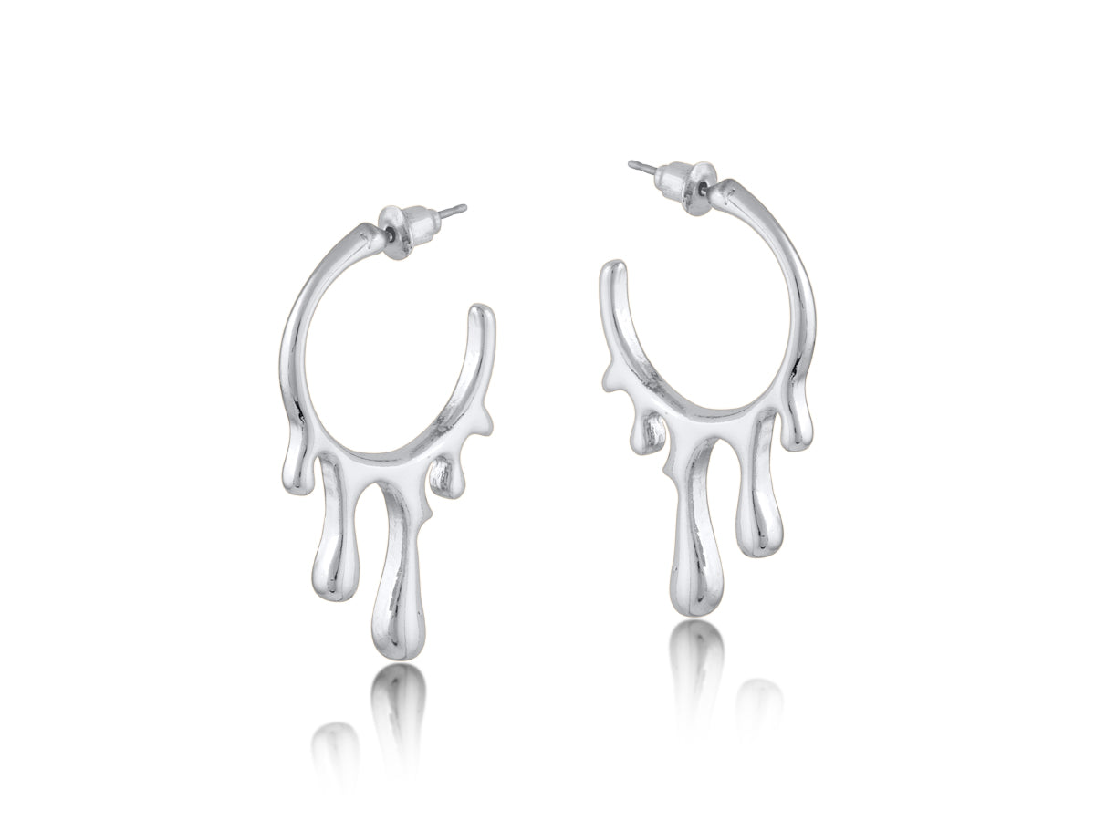 Silver drippy hoop earrings on a white background