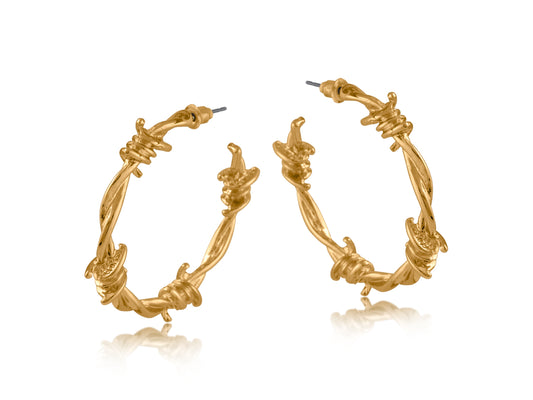 Gold hoop earrings with intricate barbed wire designs on a white background