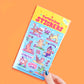Pack of stickers with cartoon animals on a yoga theme against an orange background