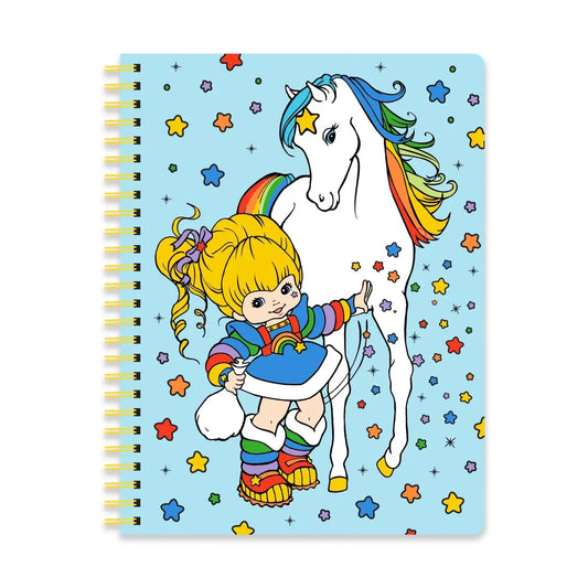 Notebook with a colorful illustration of a Rainbow Brite and unicorn on a blue background