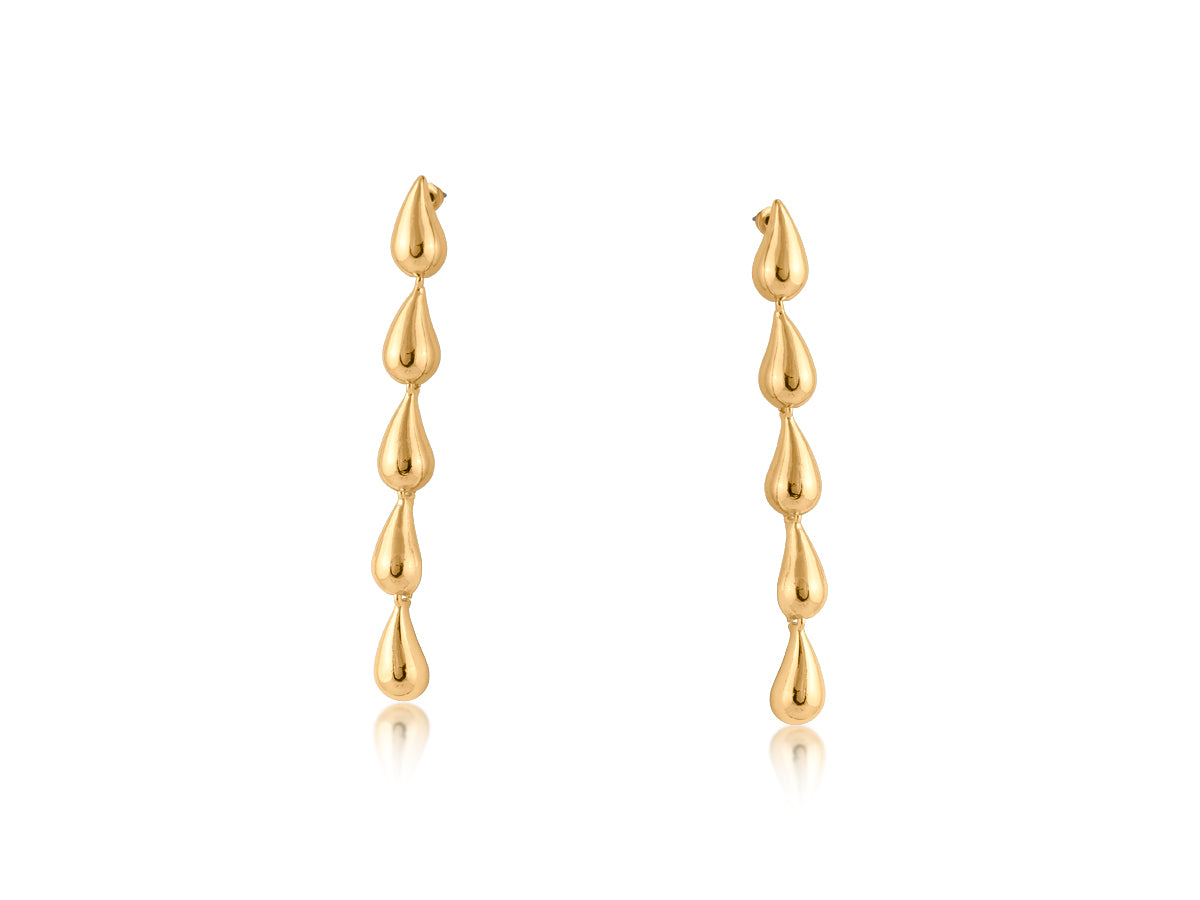 Gold raindrop earrings on a white background