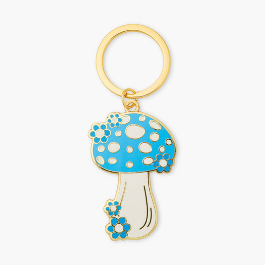 Mushroom-shaped keychain with blue top and white stem on a white background