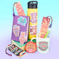 Colorful stationery items with motivational quotes on a light purple background