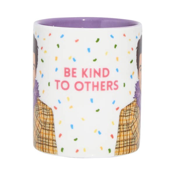 Mug with 'Be Kind to Others' text and colorful confetti pattern on a white background