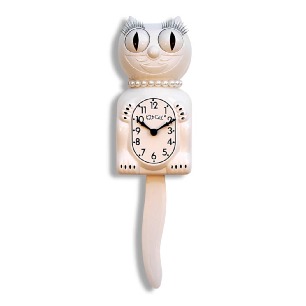 White Cat-shaped clock with pearls and eyelashes on a white background