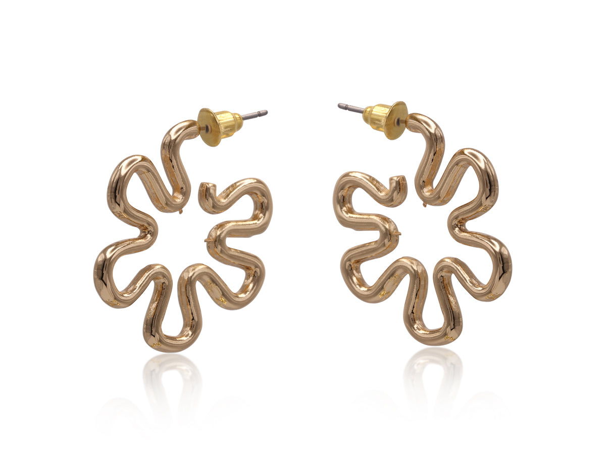 Gold floral earrings on a white background