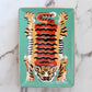 Decorative tray with a tiger design on a marble background