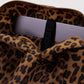Leopard print bag with a visible brand logo on a light gray background