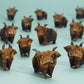 Origami highland cows on a light blue background