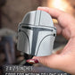 Hand holding a small helmet-shaped hair claw with text indicating size and hair type suitability.