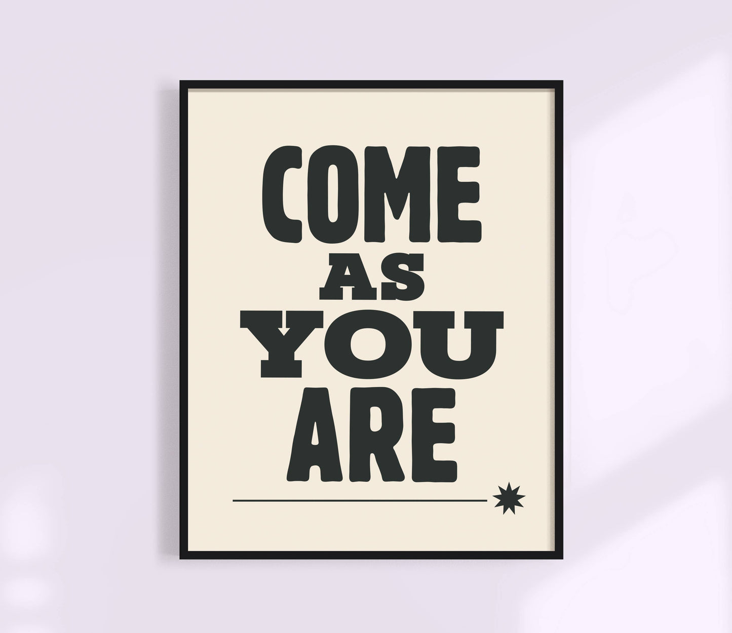Framed poster with 'COME AS YOU ARE' text on a light background