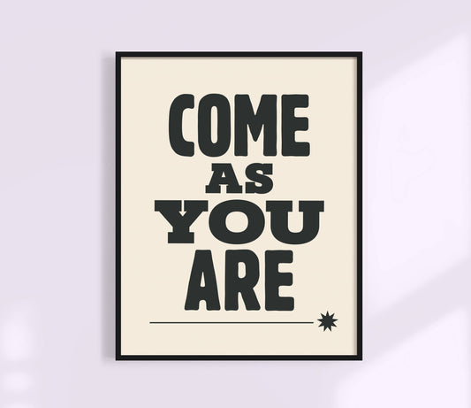 Framed poster with 'COME AS YOU ARE' text on a light background