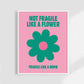 Poster with a green flower and text on a pink background