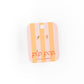 Packaging of 'pip pop' with striped design and gold lightening bolt earrings on a white background