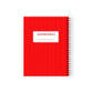 Red notebook with white polka dots and a label on a white background