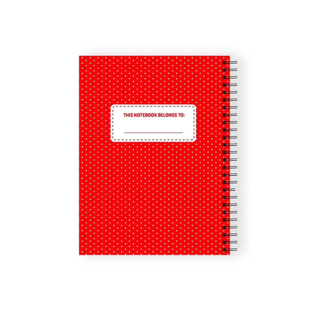 Red notebook with white polka dots and a label on a white background