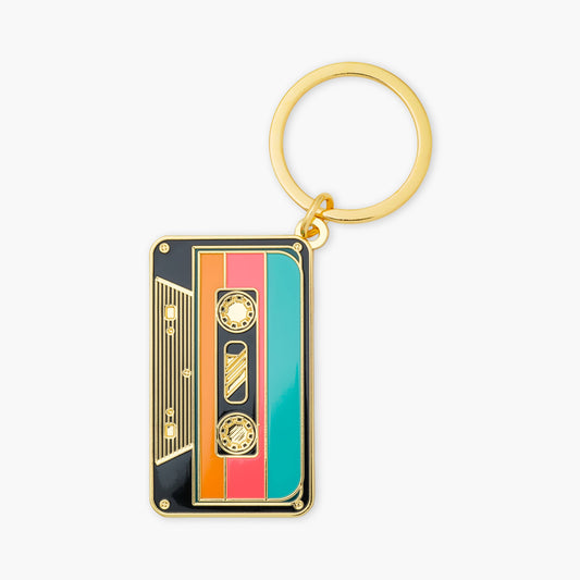 Keychain designed like a retro cassette tape on a white background