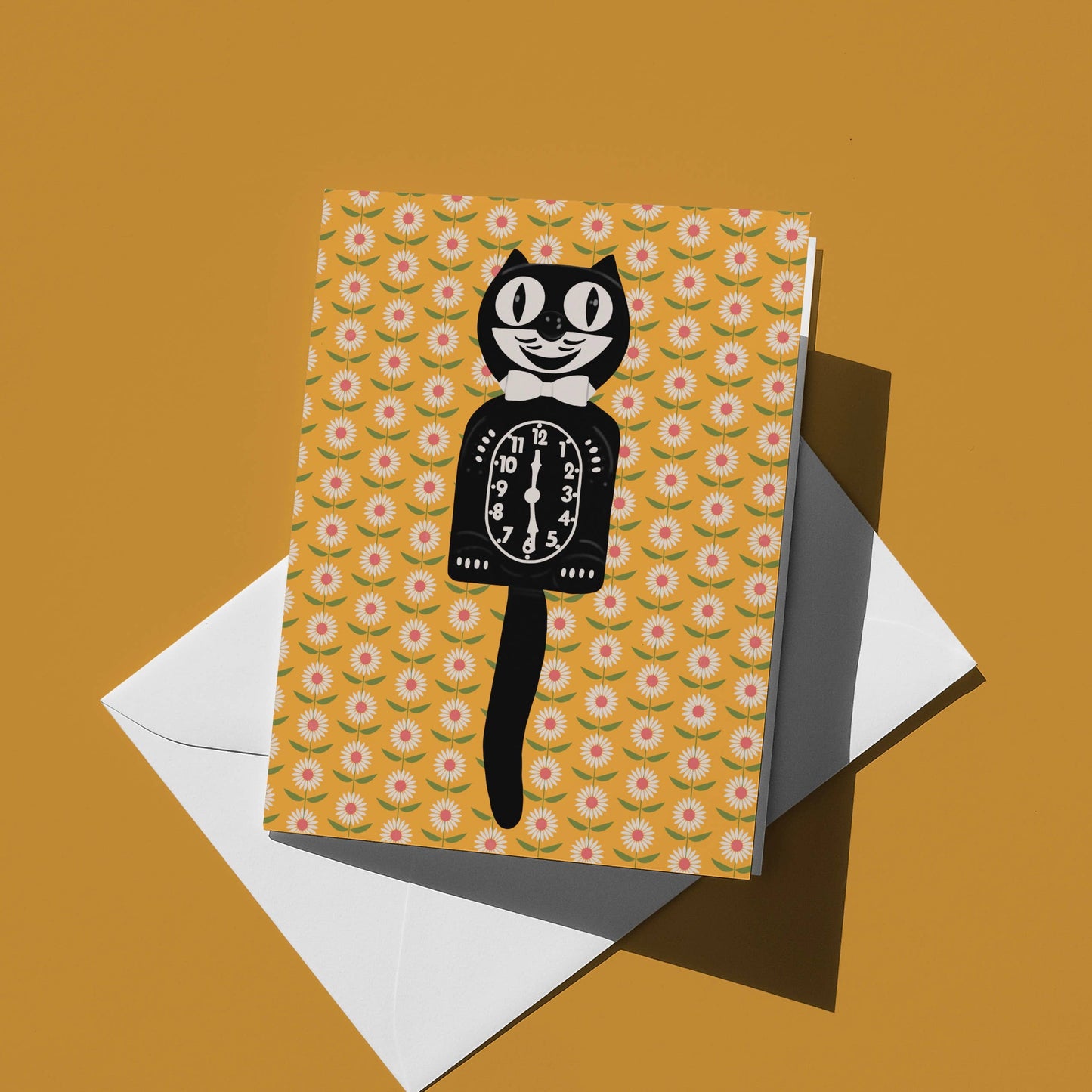 Greeting card with vintage Kitty Kat Klock illustration on a yellow floral patterned background