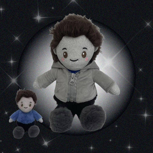 Plush toys resembling Edward from Twilight with a dark background and star-like lights