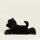 Black plush toy lying on a white background