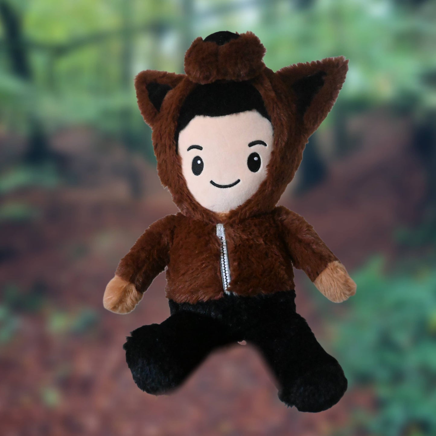 Plush toy of Jacob from Twilight in a brown animal costume with a forest background