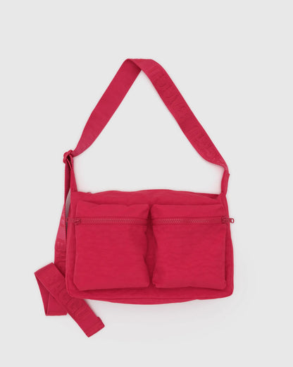 Red crossbody bag with multiple pockets on a light gray background
