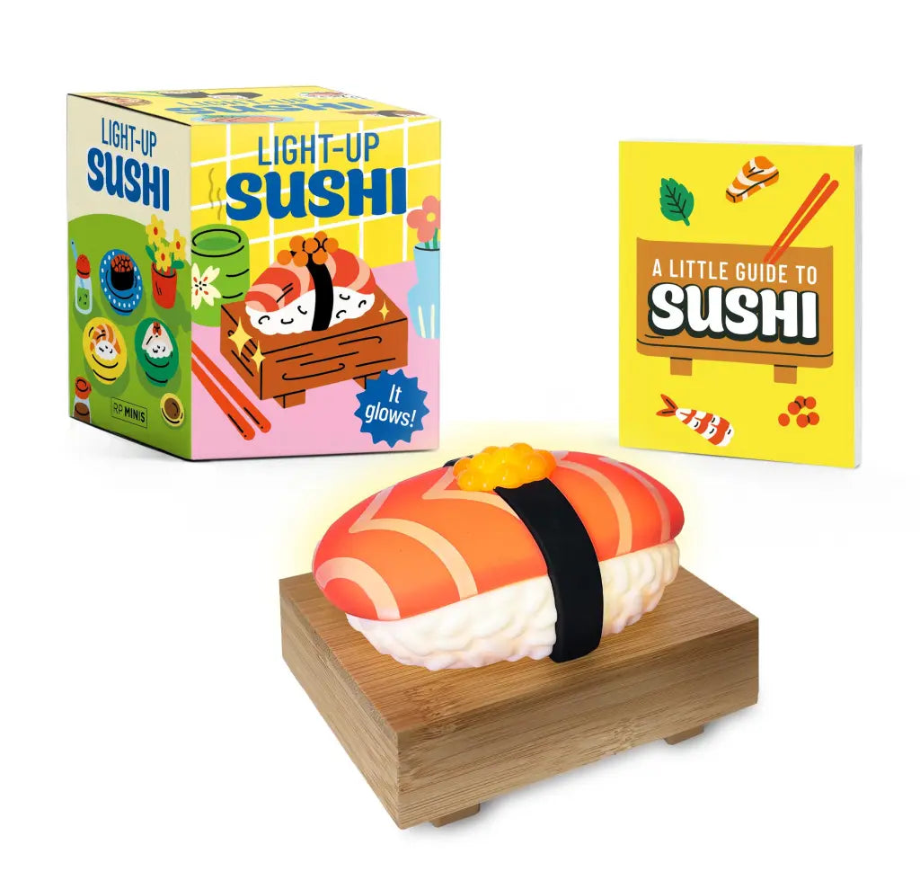 Light-up sushi toy with packaging and guide on a white background