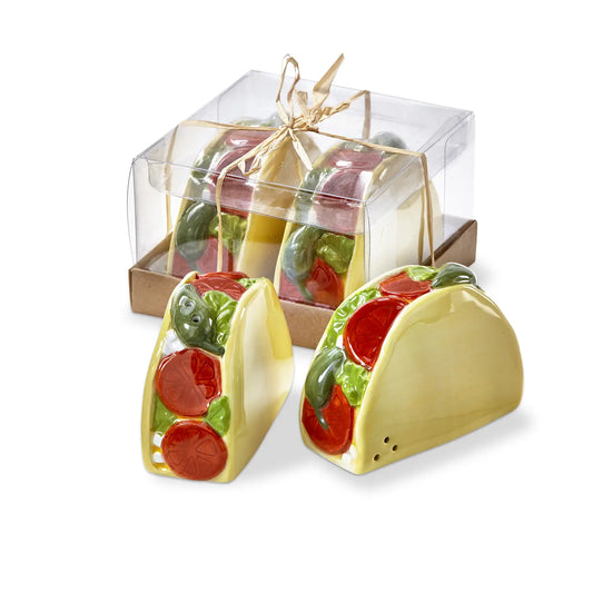 Taco-shaped salt and pepper shakers in a clear packaging box on a white background