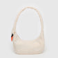 Beige handbag with a small colorful patch on a white background