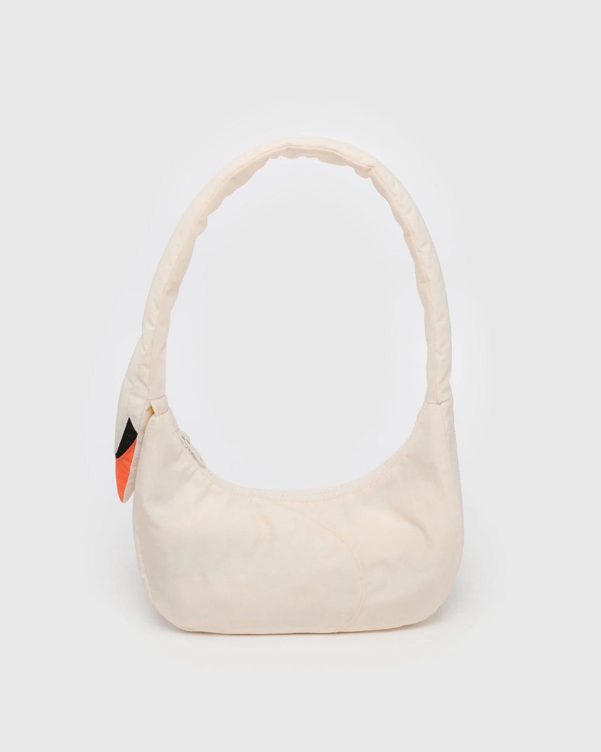 Beige handbag with a small colorful patch on a white background
