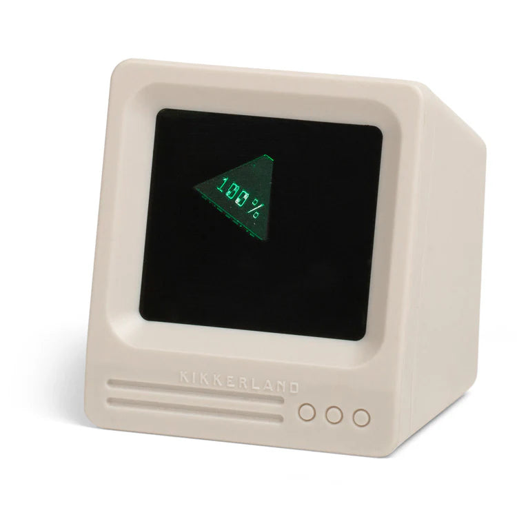 Computer display with a beige casing and green screen on a white background