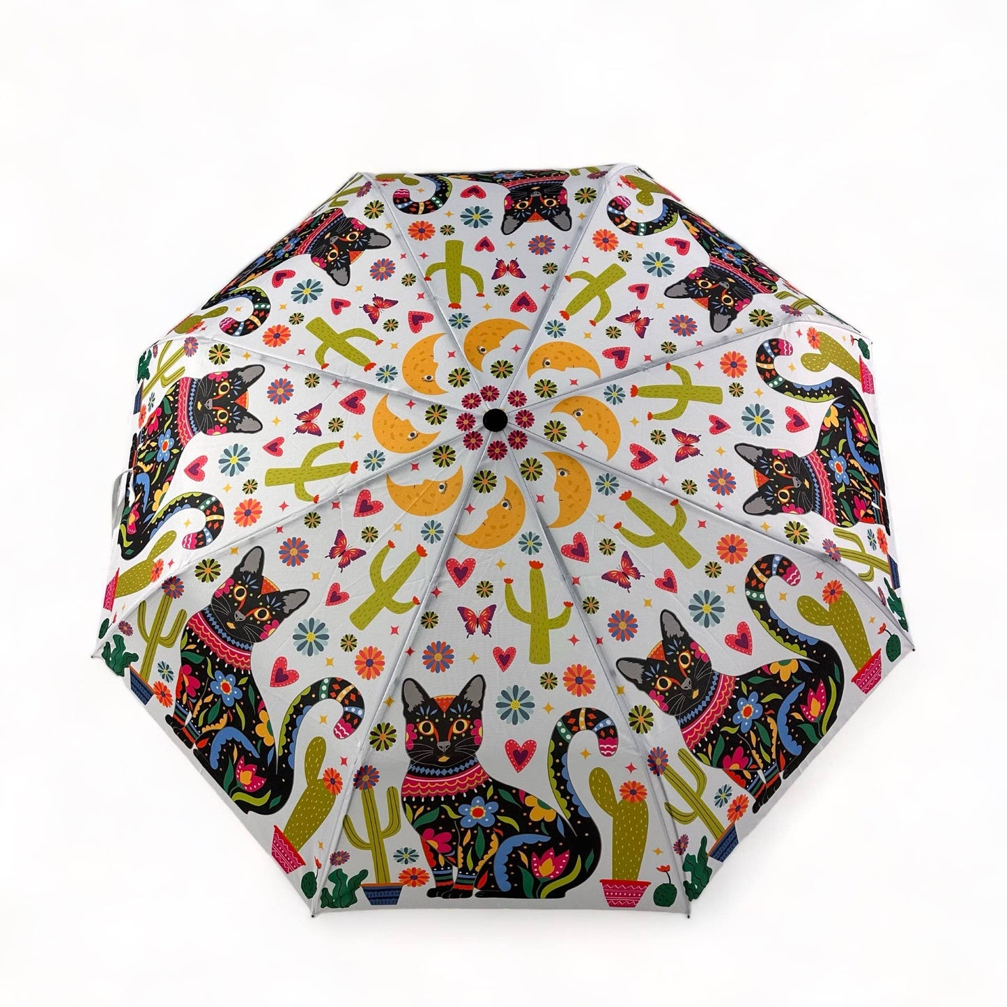 Colorful umbrella with cat and cactus pattern on a white background