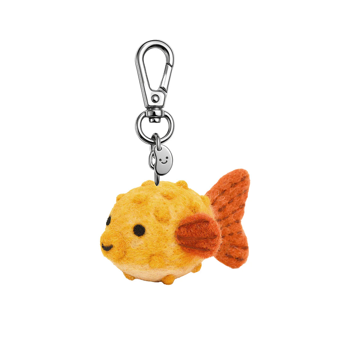 Plush pufferfish keychain with a carabiner on a white background