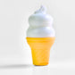 Ice cream cone-shaped container with lotion on a light gray background
