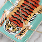 Trinket tray with tiger design on a marble surface