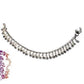Silver bangle with colorful beads on a white background