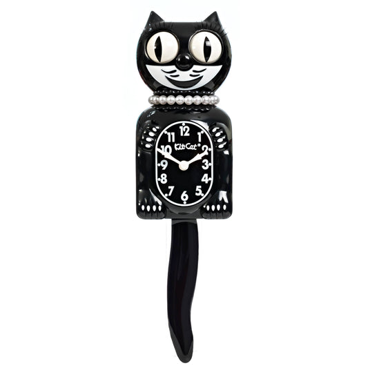 Black cat-shaped clock with pearls and white face on a white background
