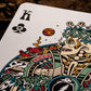 Colorful King of Clubs playing card with intricate design on a dark background