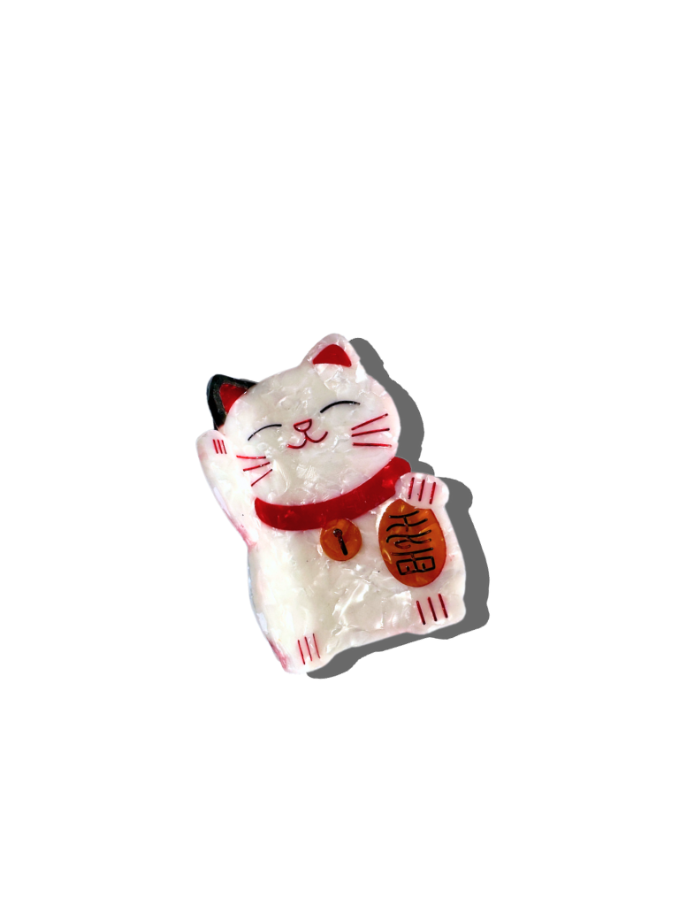 Maneki-neko cat hair claw with a red collar on a white background
